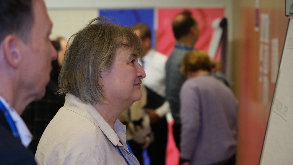 Woman and man looking a whiteboard
