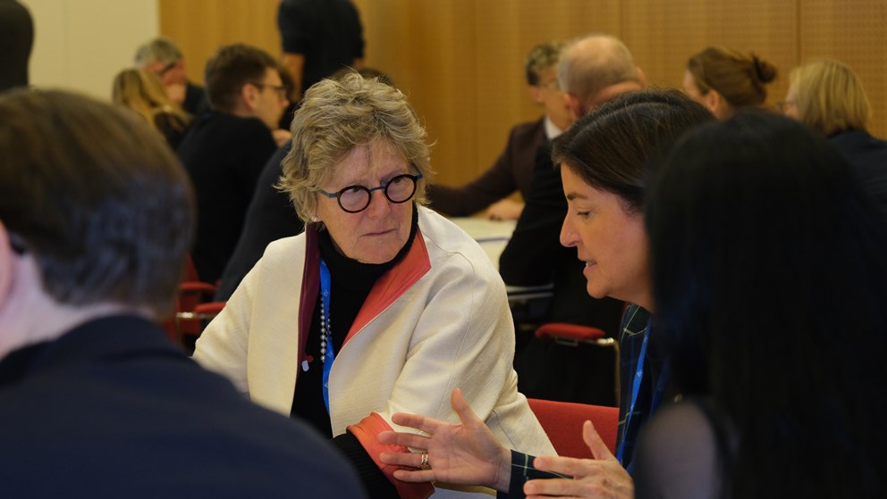 Two women discussing