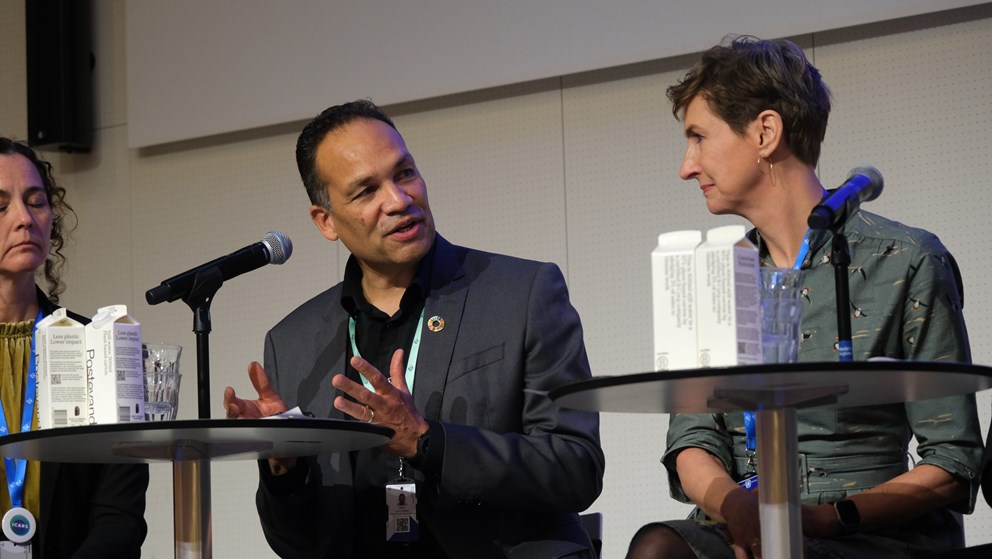 Three people in a panel debate